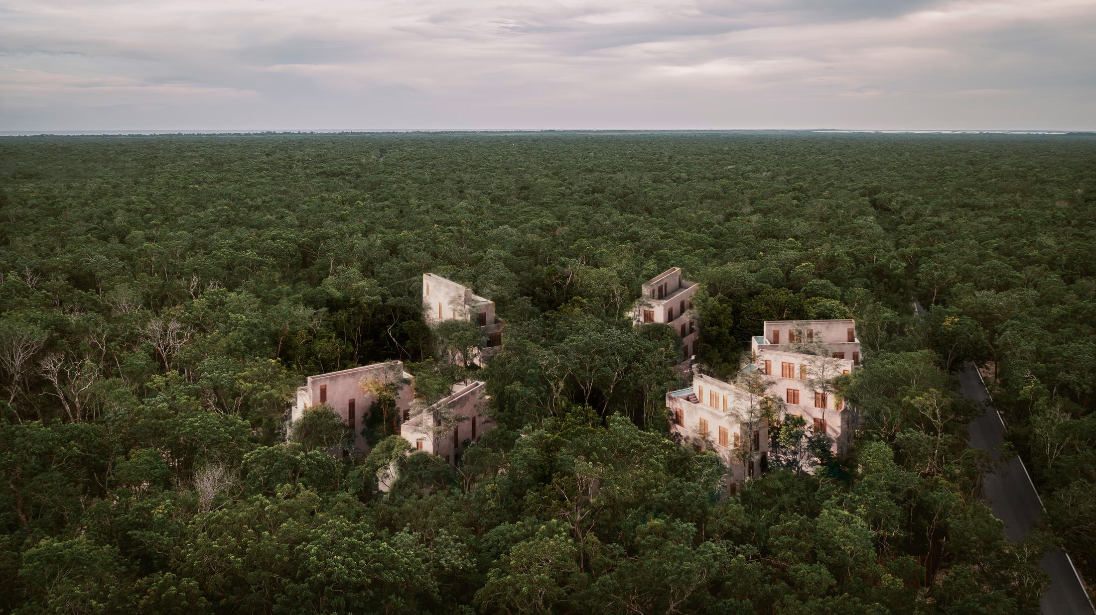 Candela's stone villas rising above the Tulum jungle canopy