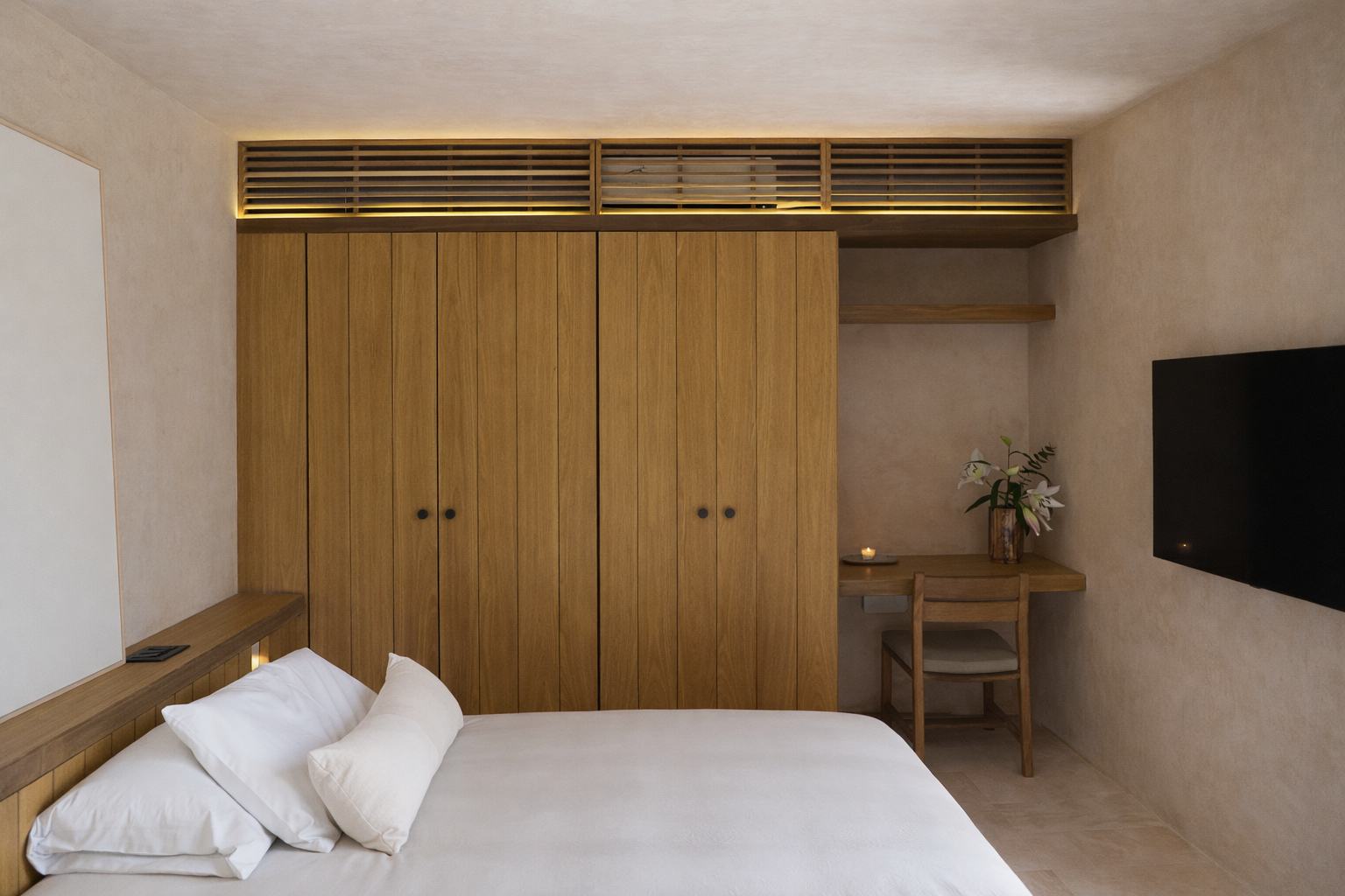 Bedroom suite opening to the jungle in a Candela villa
