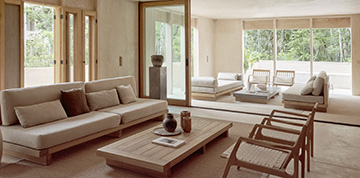 interior living room opens to open-air veranda with contemporary furnishings